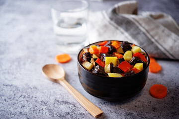 Beef potato carrot eggplant pepper stew in the bowl