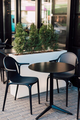 
Summer cafe with black furniture
