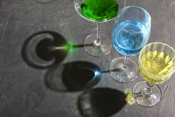 Beautiful glasses on grey background, closeup