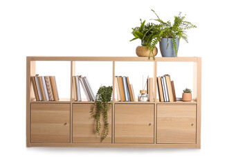 Shelving unit with books and decor on white background