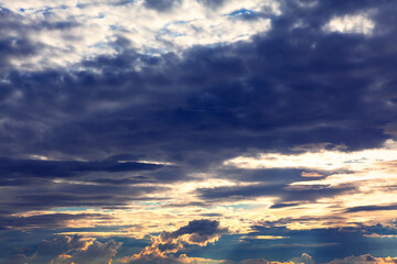 Crepuscular rays burst through the dark clouds 