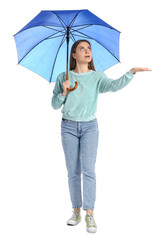 Young woman with open blue umbrella on white background