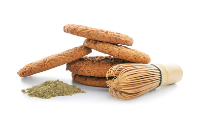 Tasty hojicha cookies, powder and chasen on white background
