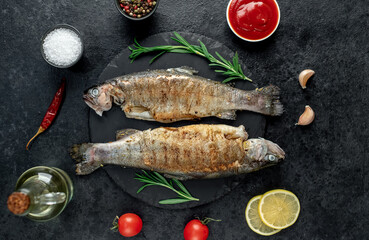 grilled trout on a stone background