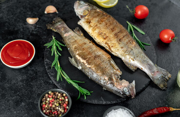 grilled trout on a stone background