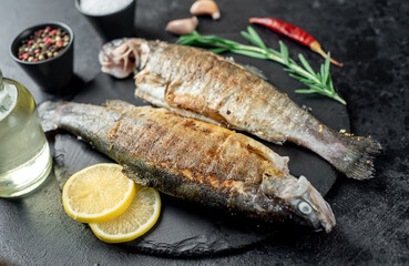 grilled trout on a stone background