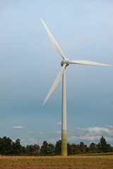 a wind turbine transforming the kinetic energy in wind into mechanical power