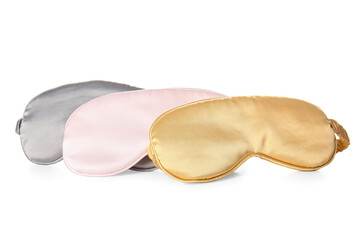 Different soft sleep masks on white background