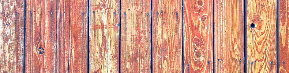 long view natural wood garden fence background with faded stain and rusty nails