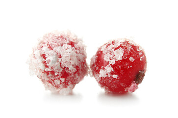 Tasty sugared cranberries on white background