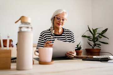 Mature woman working at office