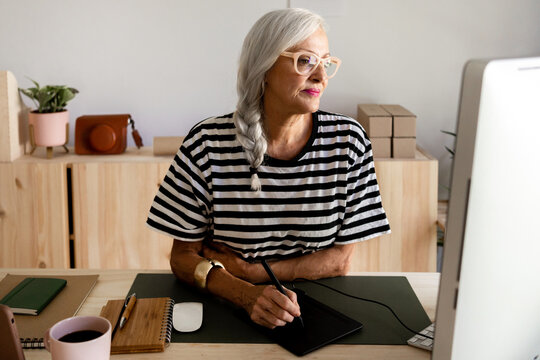 Female graphic designer working at office