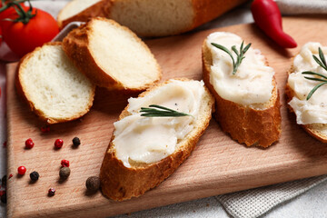 Pieces of bread with lard spread on table