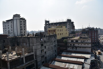 Fototapeta na wymiar バングラデシュのダッカ。 発展途上の街並み。 新しいビルや建設中の建物。