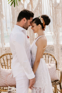 Happy newlyweds in bohemian outfits