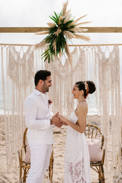 Young Hispanic couple happy at their wedding