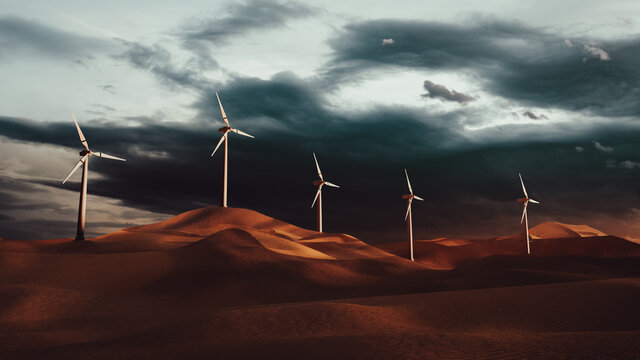 Windmills in the desert at sunset