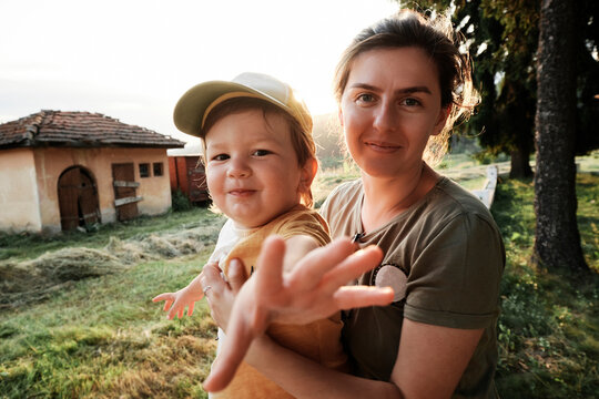 Toddler reaching out toward the camera