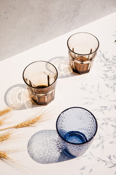 Set of blu and brown tumblers in the sun