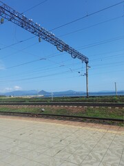 railway track, rails in the distance, road