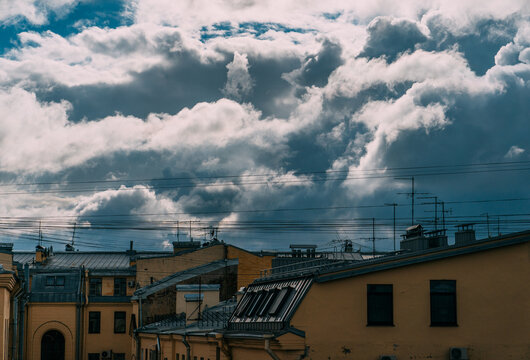 Roofs and clouds.