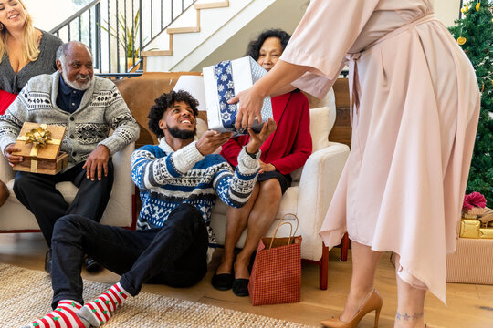 Man Recieves Gifts During Gift Exchange