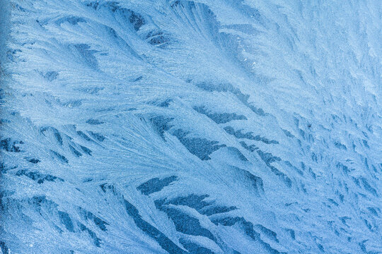 Ice texture bacground. All shades of blue and cold colors.