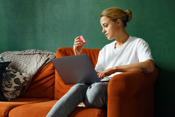 Female shopper reading credit card credentials