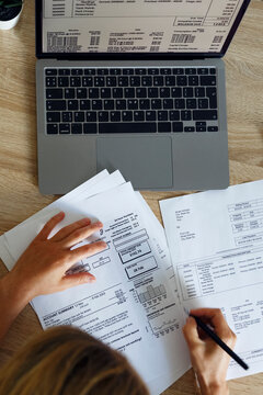 Unrecognizable accountant filling papers