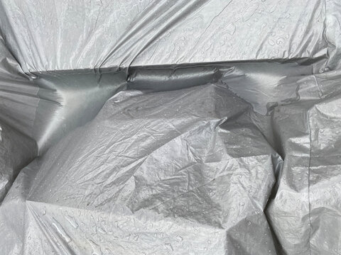 something undefined covered by plastic that got wet