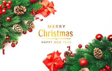 White Christmas and New Year background with red gift boxes, Christmas balls, spruce branches, cones and berries. Top view frame with copy space