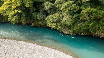 A turquoise river flowing through the mountains