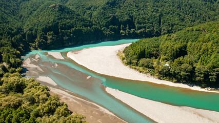 A large curved jade-colored river