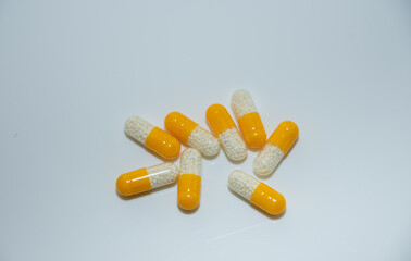 white yellow pills with white granules inside