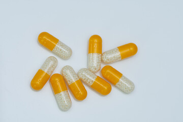 white yellow pills with white granules inside
