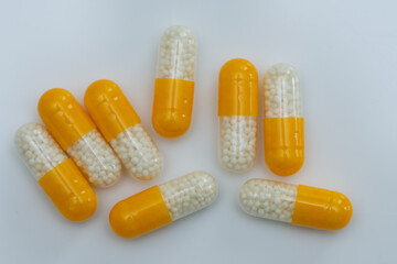 white yellow pills with white granules inside