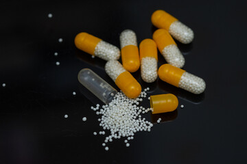 white yellow pills with white granules inside