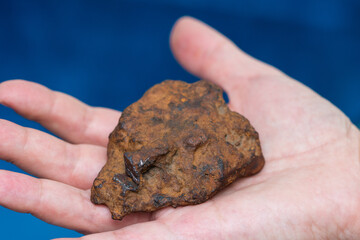 an iron meteorite in the palm ,Bistrita,Romania © photographyx