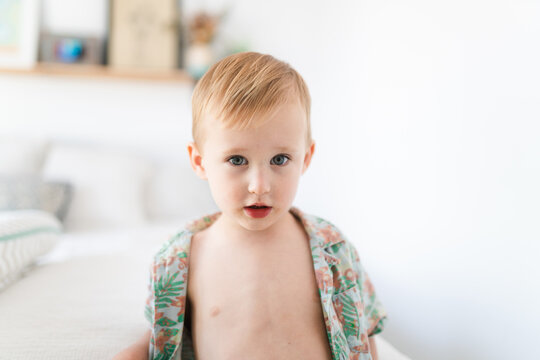 Kid with unbuttoned shirt