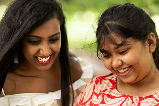 Nice facial expression of two Indian girls at outdoors