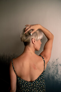 Woman holding her silver bob haircut 