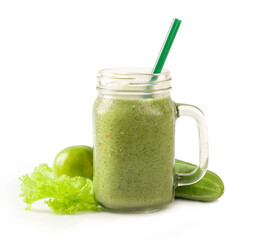 Green smoothies in glass jar with green vegetable isolated on white background.