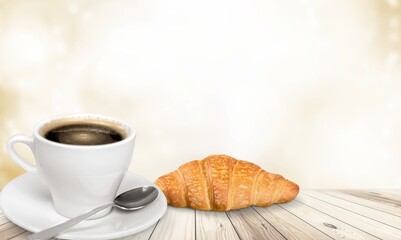Fresh delicious breakfast with Coffee, crispy croissants on desk