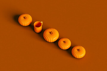 Pumpkins and a mug in a row on brown background