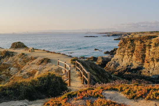 Little Bridge by a Cliff Close to the Beach during Sunset