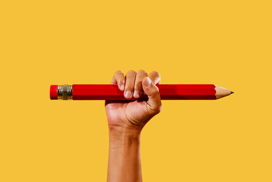 man with a large red pencil