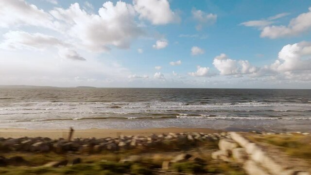 Travelling along the beautiful coast of Anglesey, North Wales UK, featuring fine sandy beaches