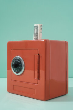 Close Up Of Red Vault With One Dollar Bill 