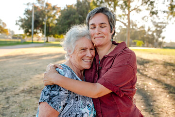 Loving moment as daughter embraces senior mother