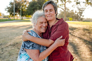 Tender moment between woman and elderly mom